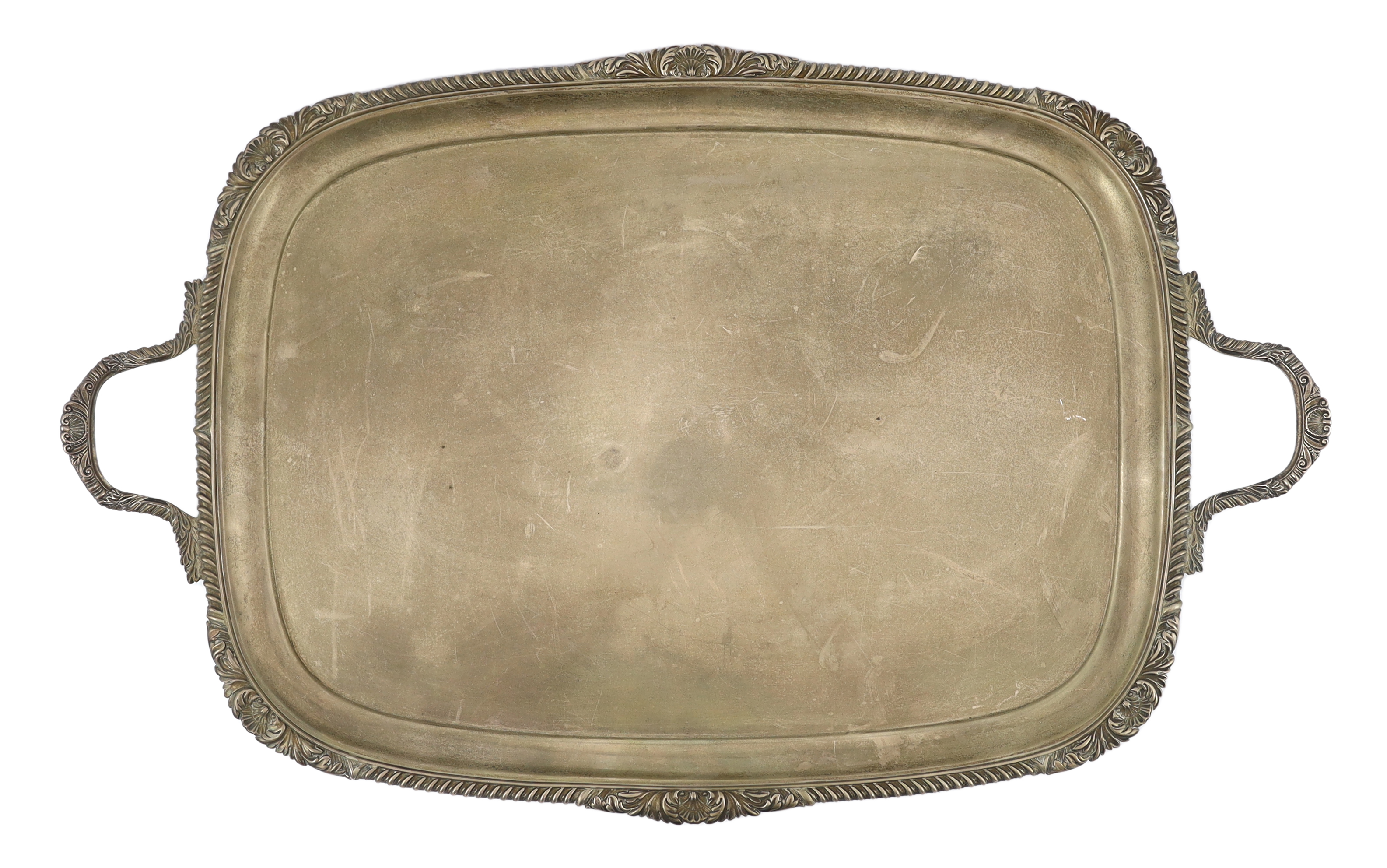 A late Victorian silver two handled rounded rectangular tea tray, by Goldsmiths & Silversmiths Co. Ltd